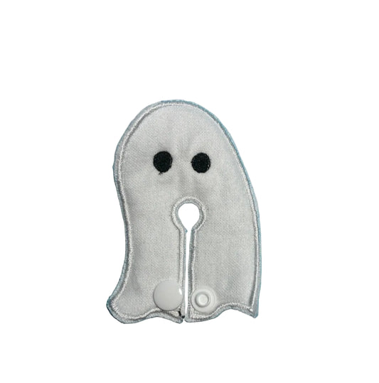 Ghost-shaped white g-tube pad with embroidered eyes and a snap closure